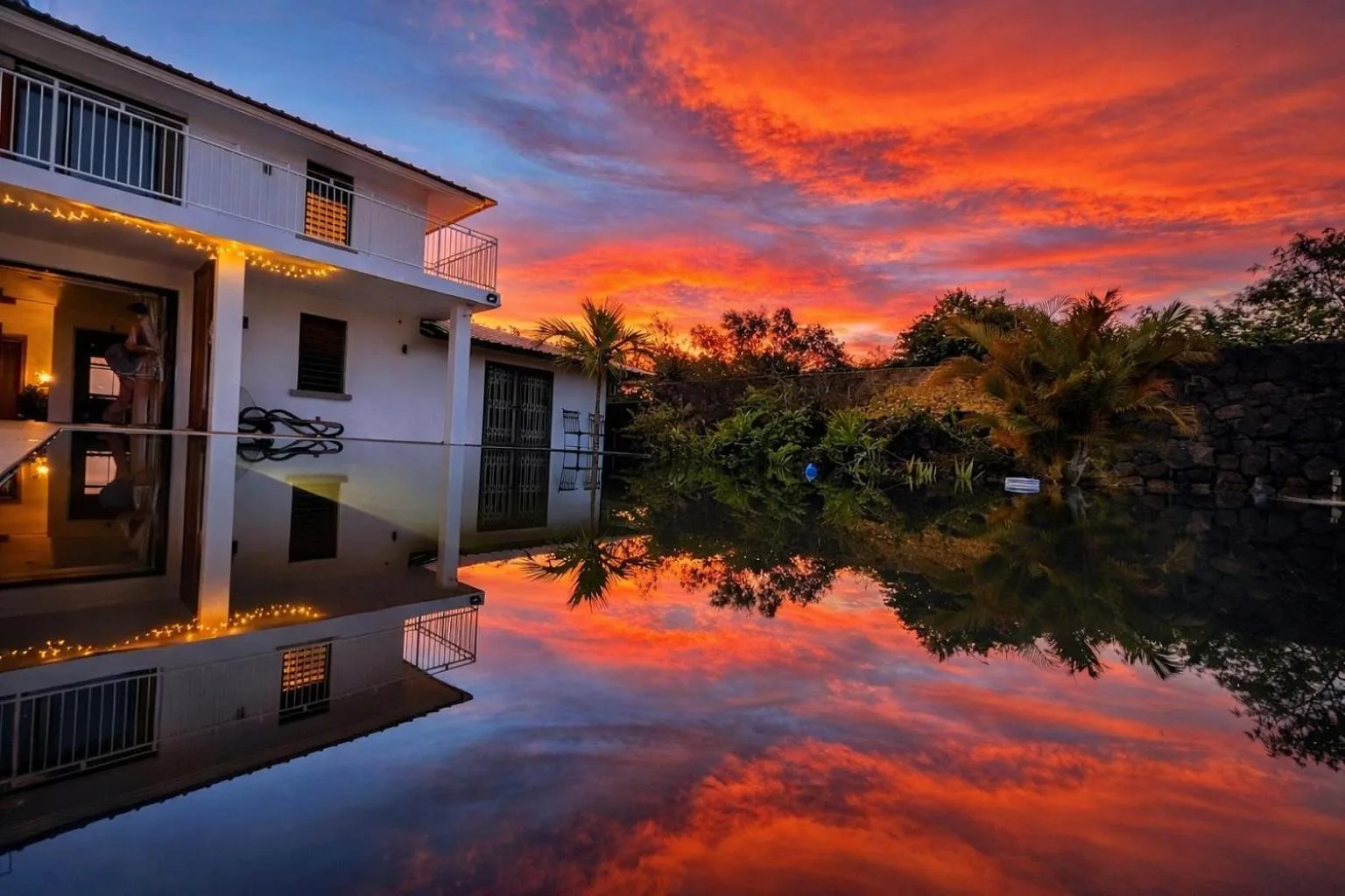 The pool mirroring the sunset