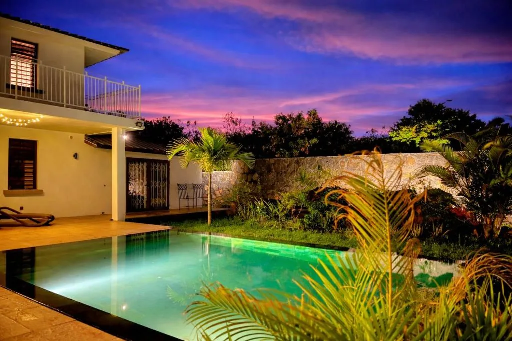 The pool and terrace at sunset